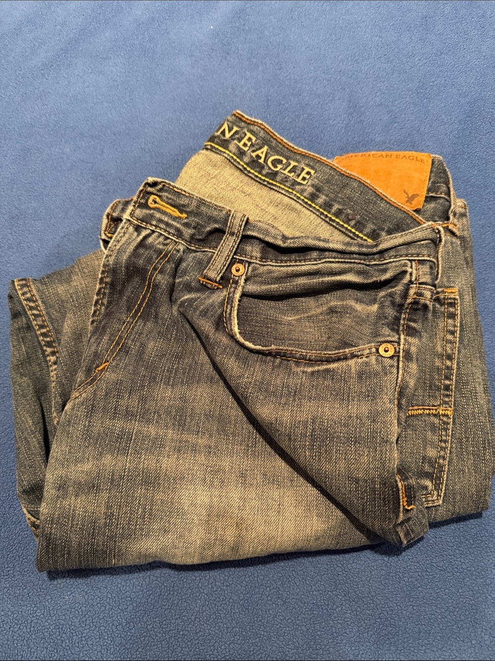 American Eagle Outfitters Men’s Faded Blue Slim Jeans with Contrast Stitching